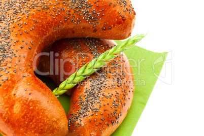 bread with poppy seeds and ear isolated on white