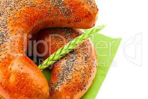 bread with poppy seeds and ear isolated on white