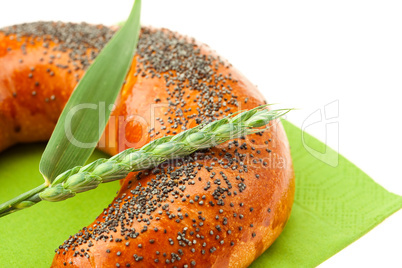 bread with poppy seeds and ear isolated on white