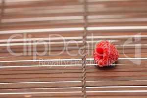 Raspberry on a bamboo mat