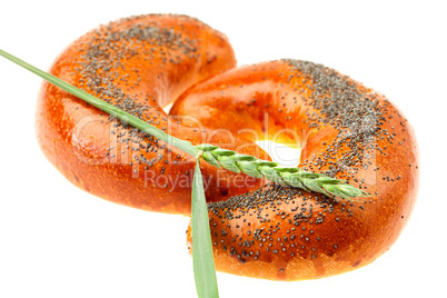 bread with poppy seeds and ear isolated on white