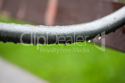 Detail of the benches with rain drops