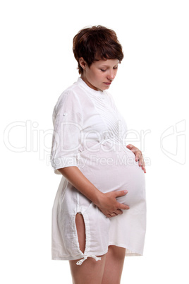 Pregnant young woman in a white shirt