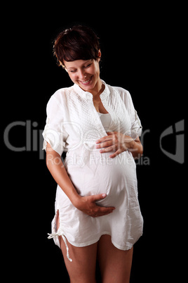 Pregnant young woman in a white shirt