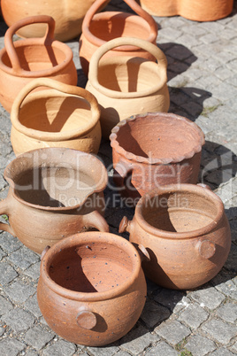 Clay pots on pavement