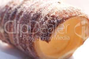 roll with sugar and cinnamon on the table