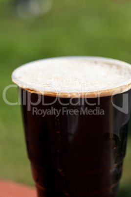 glass of dark beer on the table