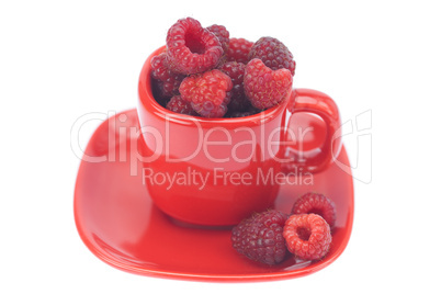 raspberry, saucer and cup is isolated on a white