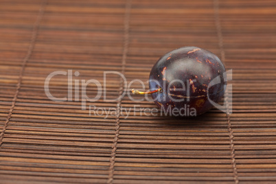 Plum on a bamboo mat