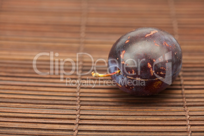 Plum on a bamboo mat