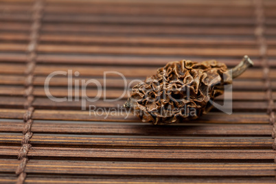 Dried walnut on a bamboo mat