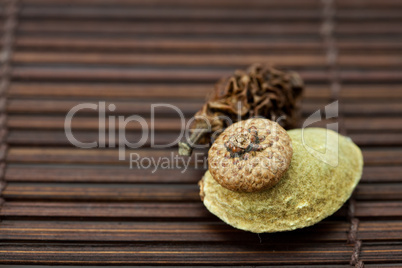 Almonds and walnuts on a bamboo mat