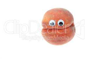 Peach with eyes isolated on white