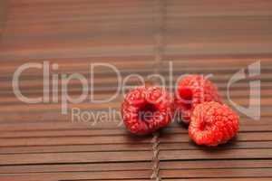 Raspberries on a bamboo mat