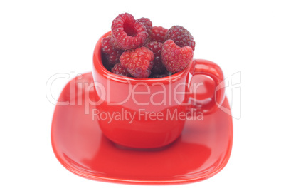 raspberry, saucer and cup is isolated on a white