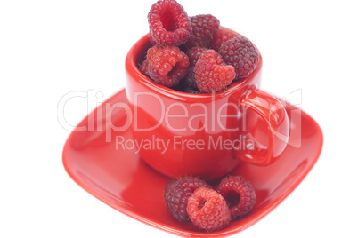 raspberry, saucer and cup is isolated on a white