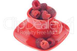raspberry, saucer and cup is isolated on a white