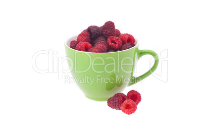 raspberry, saucer and cup is isolated on a white