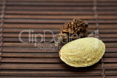 Almonds and walnuts on a bamboo mat