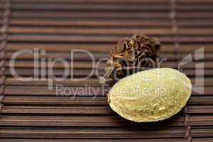 Almonds and walnuts on a bamboo mat