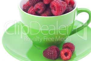 raspberry, saucer and cup is isolated on a white