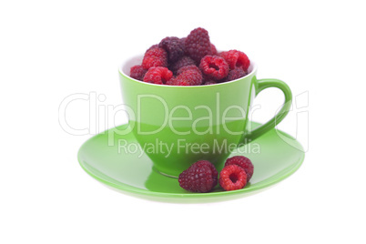 raspberry, saucer and cup is isolated on a white