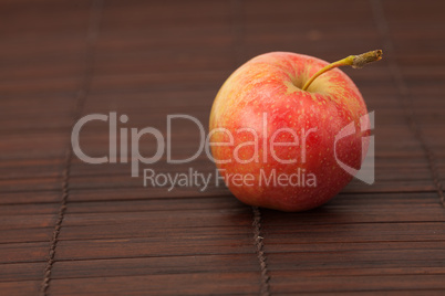 apple on a bamboo mat