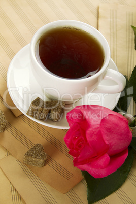 A cup of tea and rose