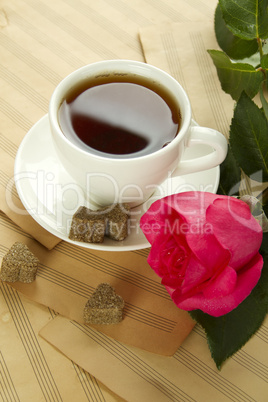 A cup of tea and rose