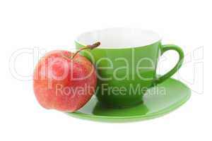 cup, saucer and apples isolated on white