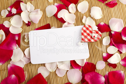 Card and rose petals