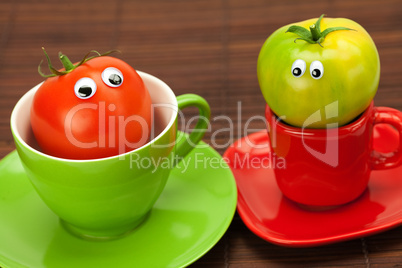 tomato with eyes in the cup on a bamboo mat
