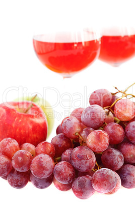 glass of wine and a bunch of grapes isolated on white