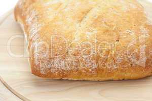 bread on a cutting board isolated on white