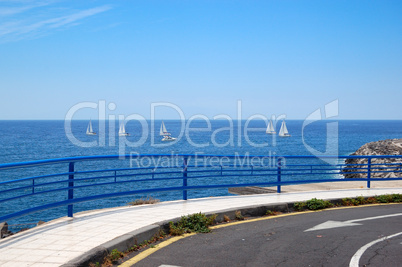 Road and fence with a view on Atlantic Ocean, Tenerife island, S