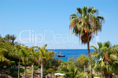 Beach at luxury hotel and sail yacht, Tenerife island, Spain