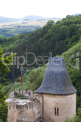 towers of the fortress against the sky and hills