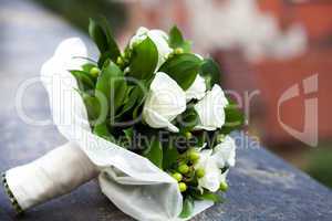 bridal bouquet lying on the concrete