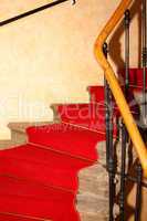 staircase with red carpet