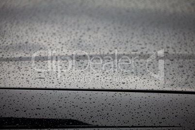 water droplets on the hood of a car