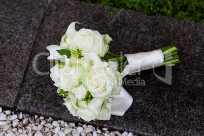 bridal bouquet on the concrete parapet