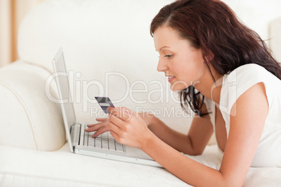 Dark-haired woman doing some online shopping