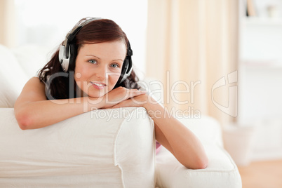 Dark-haired young woman listening to music