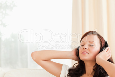 Relaxing woman listening to music