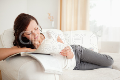 Young woman studying on the sofa