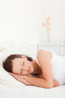 Close up of a sleeping red-haired woman