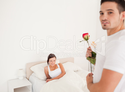 Cute guy with a rose for his girlfriend