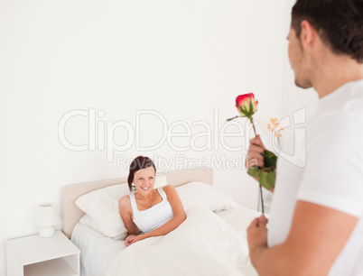 Handsome guy with a rose for his girlfriend