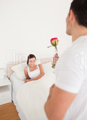 Handsome guy with a rose for his partner