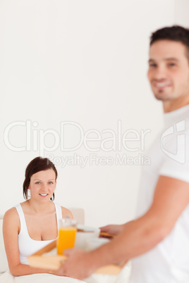 Man bringing his wife breakfast